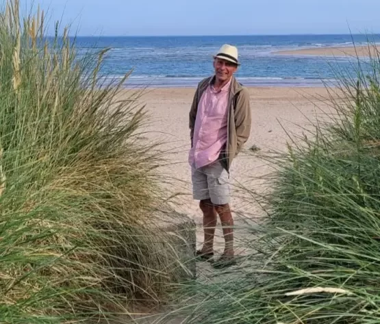 David Farn standing on a beach